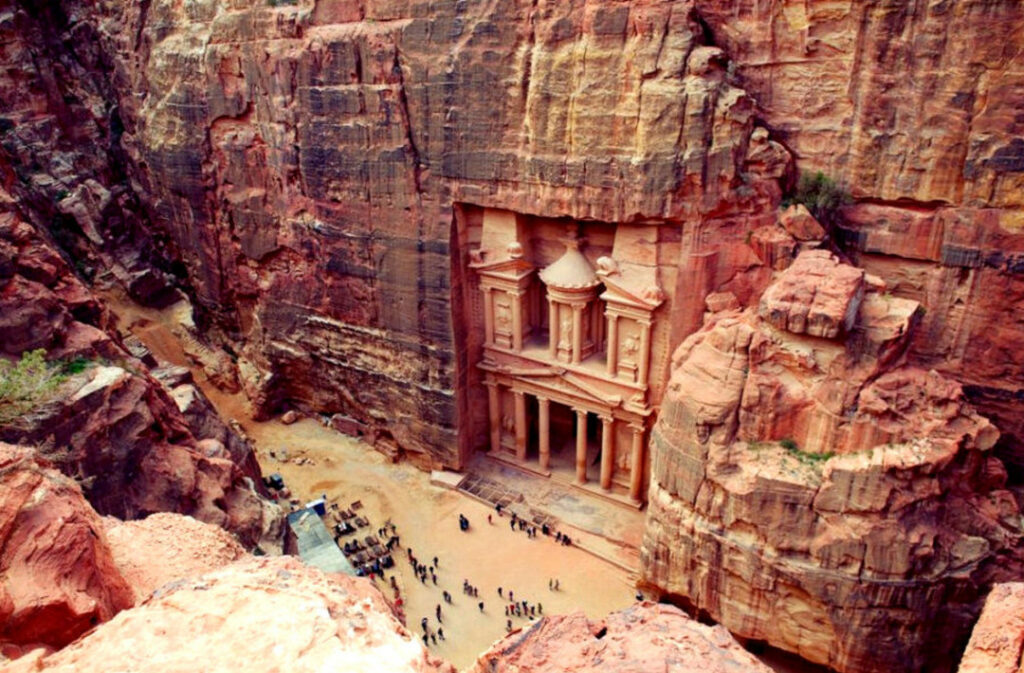An artistic representation of the lost city of Petra, surrounded by the stunning landscapes of the Jordanian desert.